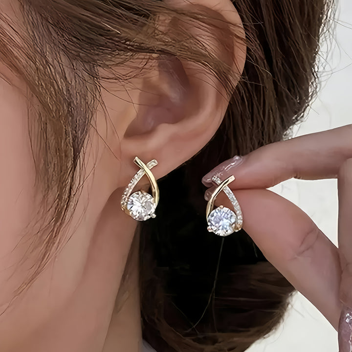 Oorbellen met gouden kruis en zirconia