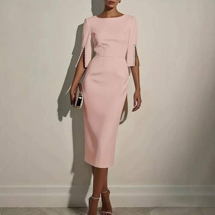 LUCIA - ELEGANTE JURK MET OPEN MOUWEN GERAFFD MET PARELS